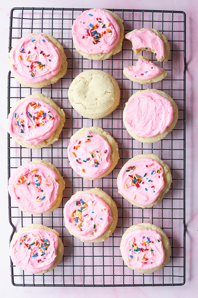 A cooling rack with freshly baked Lofthouse Sugar Cookies.